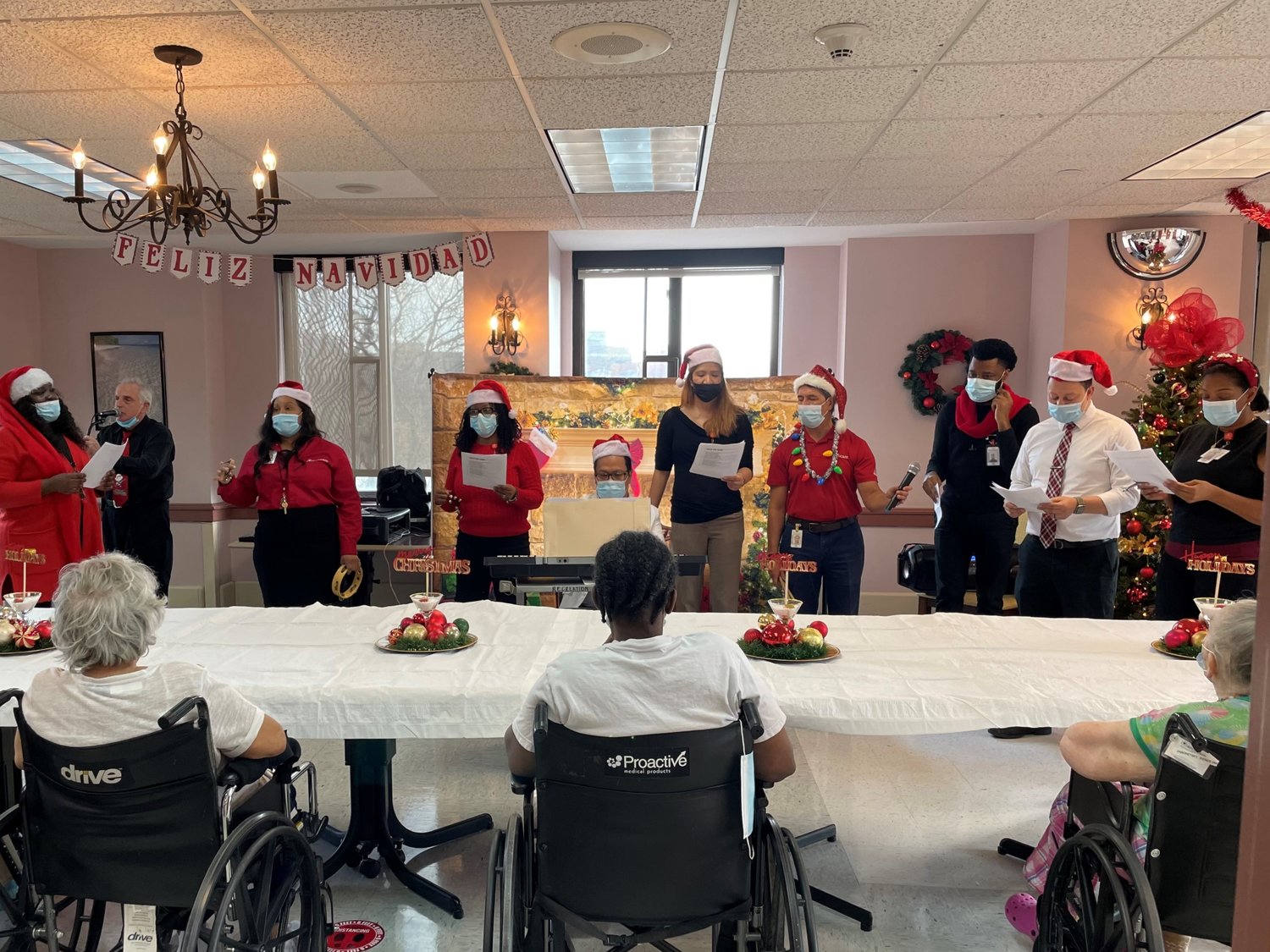 Carolers sing at the ArchCare Senior Life at San Vicente de Paul.